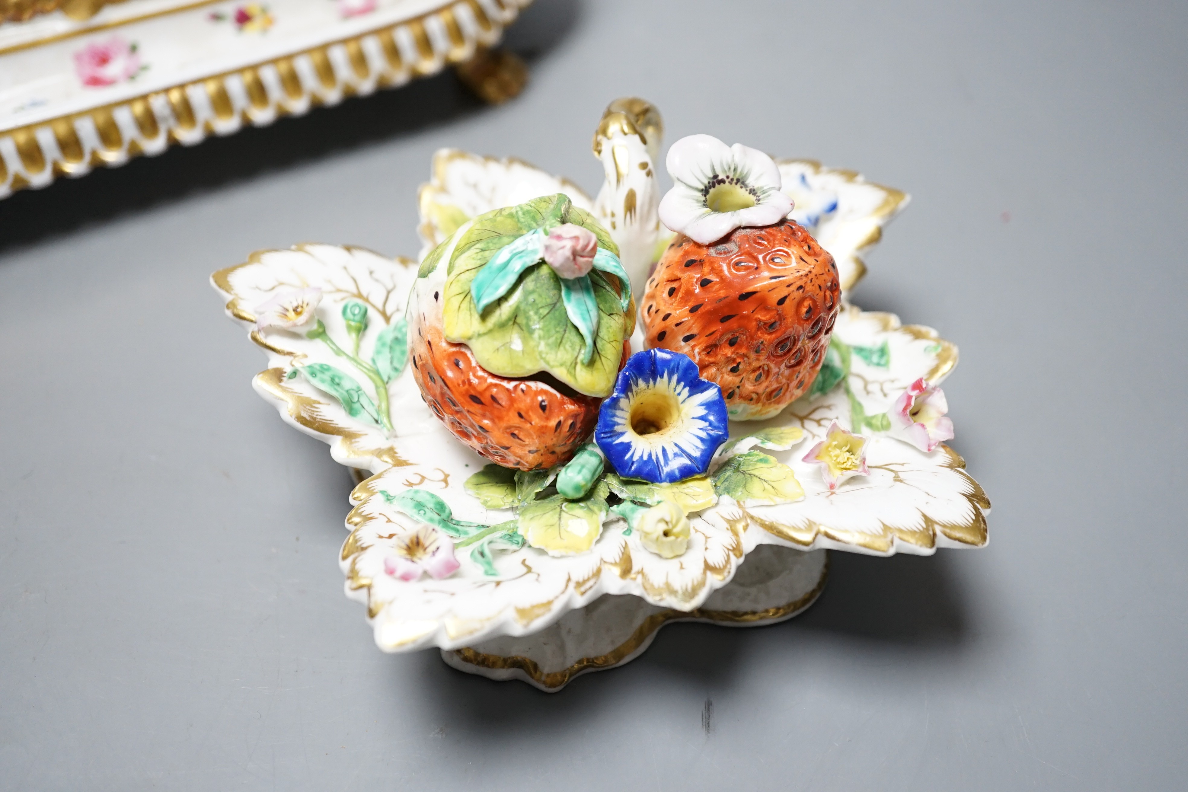 A 19th century Chamberlain Worcester inkstand painted with roses and heatsease, script mark, and a 19th century English porcelain leaf shaped inkwell with strawberry shaped wells, encrusted with flowers picked out in gil